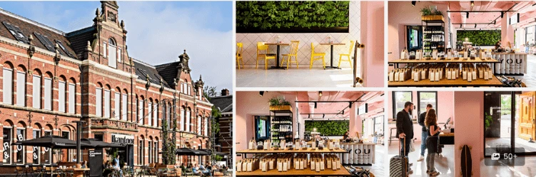 Brick building exterior with chic, plant-filled café interiors, echoing stylish Amsterdam hotel vibes.