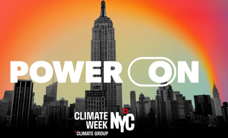 Empire State Building with POWER ON text and a rainbow gradient for Climate Week NYC.